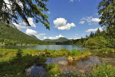 Scenic view of lake and mountains against sky