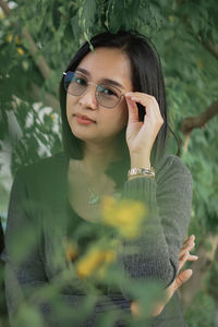 Portrait of young woman wearing sunglasses