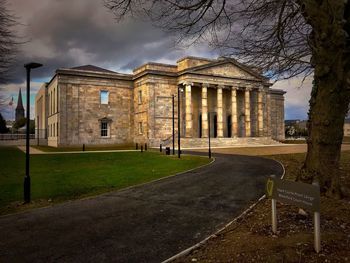 Building in park against cloudy sky