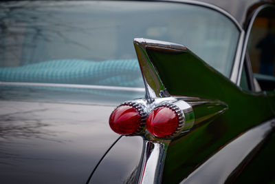 Close-up of red car on water