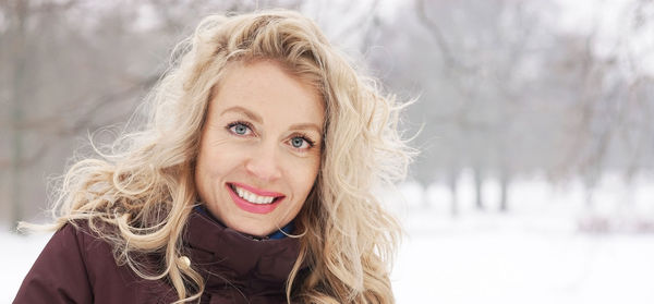 Portrait of smiling mature woman during winter