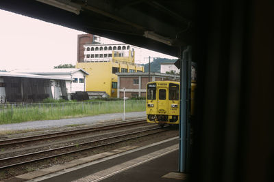 Train on railroad tracks in city