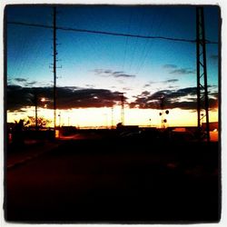 Electricity pylons at sunset