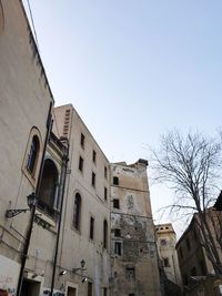 Low angle view of buildings against clear sky