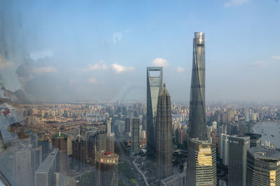 I took these pictures through the window from the oriental pearl tower. 