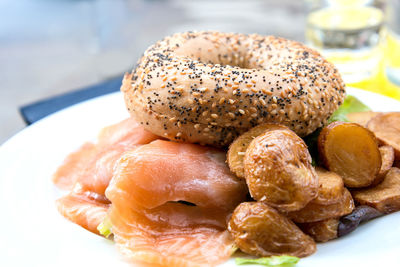 Bagel served with salmon and baked potato