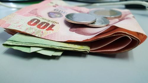 High angle view of coins on table