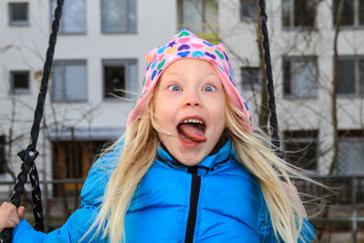 Portrait of young girl making funny face