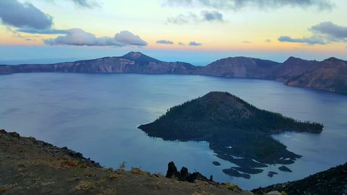 Scenic view of sea against cloudy sky