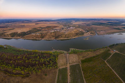 Juromenha castle, village and guadiana river drone aerial view at sunset in alentejo, portugal