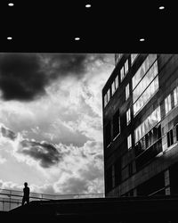 Low angle view of building against cloudy sky