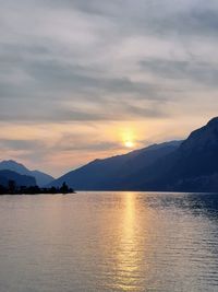 Scenic view of lake against sky during sunset