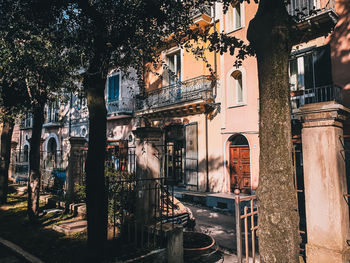 Panoramic view of old building by street in city