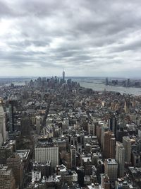 High angle view of buildings in city against sky