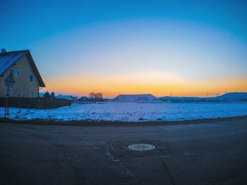 Scenic view of sea against clear sky during sunset