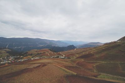 View of landscape against cloudy sky