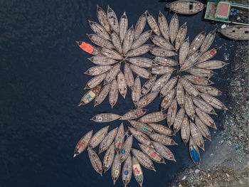 Aerial view of wooden passenger boats along the buriganga river, keraniganj, dhaka, bangladesh