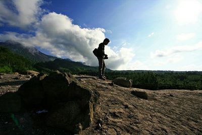 Full length of man standing on hill