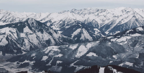 Scenic view of snow covered mountains against sky