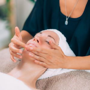 Close-up of woman getting massage therapy at spa