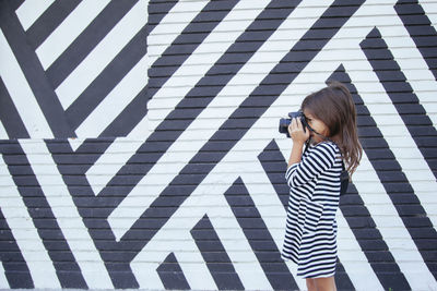 Full length of woman photographing