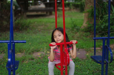 Portrait of girl playing on playground