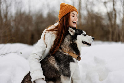 Happy young woman with dog