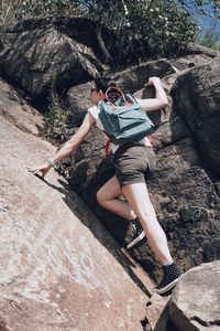 Low section of person standing on rock