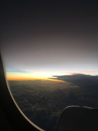 Scenic view of cloudscape seen through airplane window