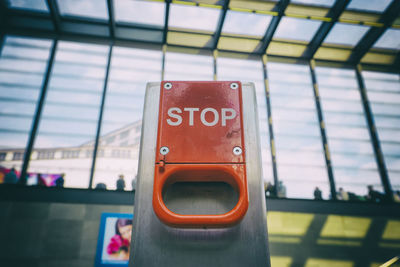 Close-up of stop text on emergency brake at berlin potsdamer platz