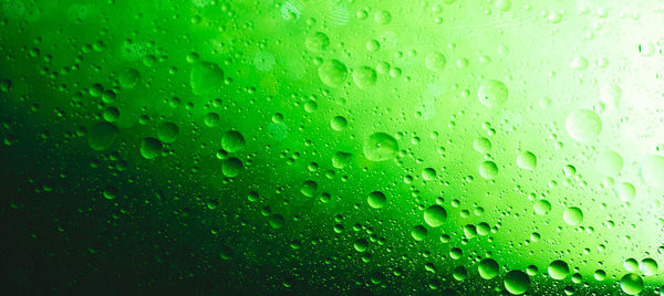 Full frame shot of wet glass window during rainy season