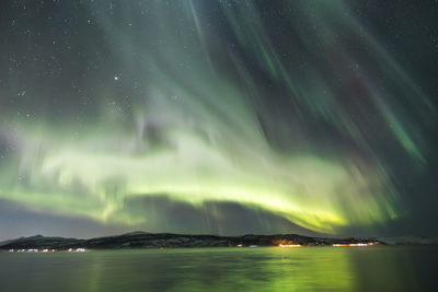 Scenic view of sea against sky at night