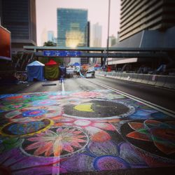 Colorful building with city street in background