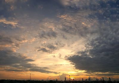 Low angle view of silhouette buildings against sky during sunset