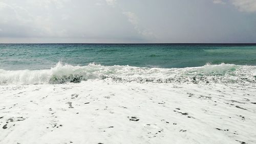 Scenic view of beach against sky