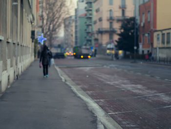 Man walking on street in city