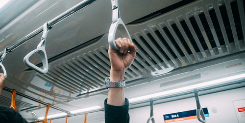 Low angle view of woman hand in car