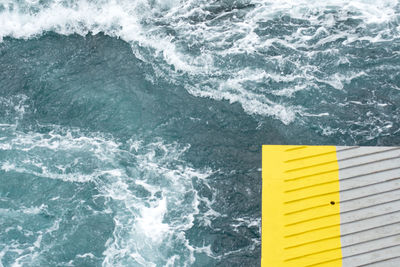 High angle view of yellow water in sea