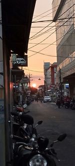 View of city street during sunset