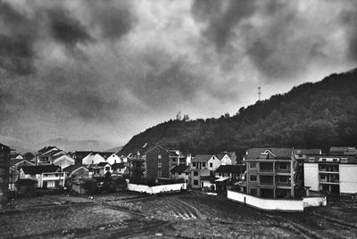 Mountain range against cloudy sky