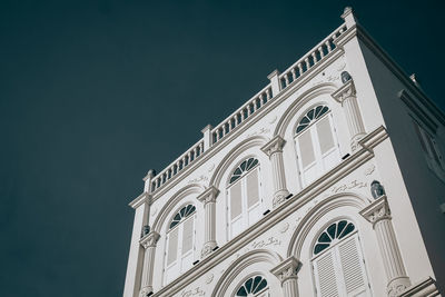 Low angle view of building against blue sky