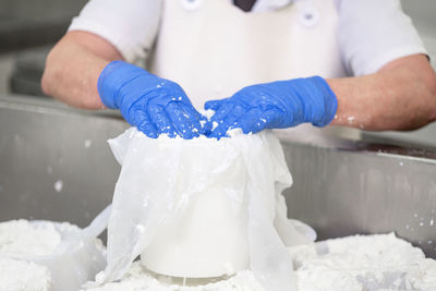 Midsection of man preparing food