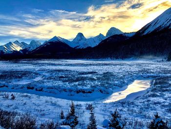 Scenic view of frozen lake against sky during winter