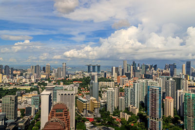 High angle view of modern buildings in city against sky