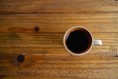 High angle view of coffee cup on table