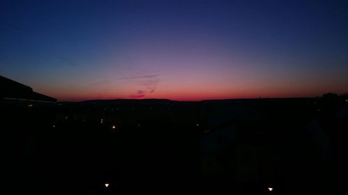 Scenic view of landscape against sky at night