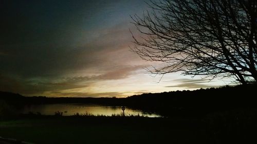 Scenic view of lake at sunset