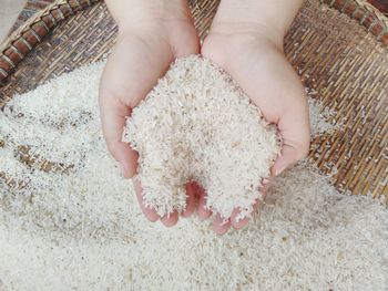 High angle view of hands holding ice cream cone