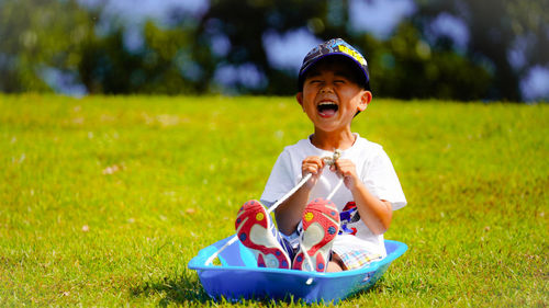 Boy grass sking  on field