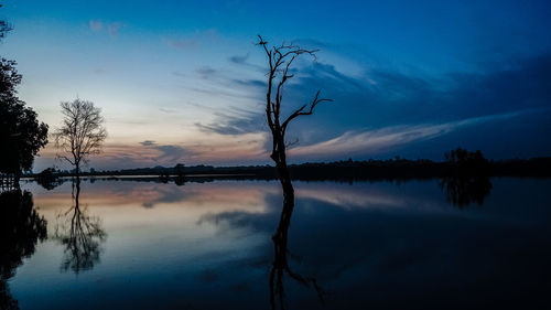 Scenic view of lake against sky during sunset